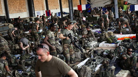 FILE - French troops gather in a hangar at Bamako's airport, Tuesday, Jan. 15, 2013. French President Emmanuel Macron announced at a press conference Thursday Feb. 17, 2022 that he is withdrawing French troops from Mali.