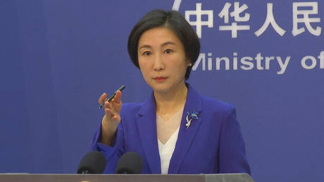 Chinese Foreign Ministry spokesperson Mao Ning gestures during a press conference at the Ministry of Foreign Affairs in Beijing, Thursday, Oct 13, 2022.