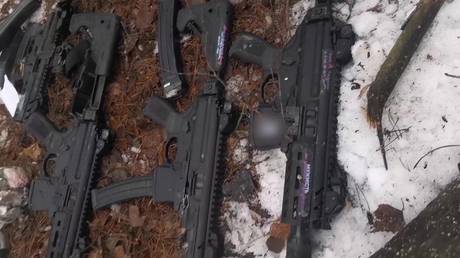 FILE PHOTO: Assault rifles of members of a group of saboteurs from Ukraine, who were killed by FSB officers during an attempt to cross the Russia's border, lie on the ground in Bryansk region, Russia.