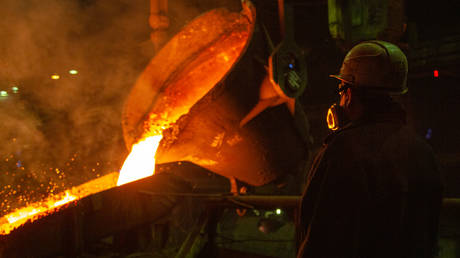 An employee works at a smelting workshop at the Norilsk Nickel plant, in Nikel, Russia.