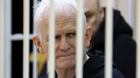 In this file photo taken on January 05, 2023 Nobel Prize winner Ales Belyatsky is seen in the defendants' cage in the courtroom in Minsk.