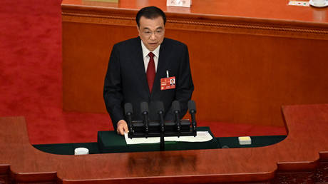 China's Premier Li Keqiang delivers his work report during the opening session of the National People's Congress in Beijing.  on March 5, 2023.

NOEL CELIS / AFP