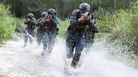FILE PHOTO. Special forces soldiers train in an unfamiliar area in laibin City, Guangxi Province, China.