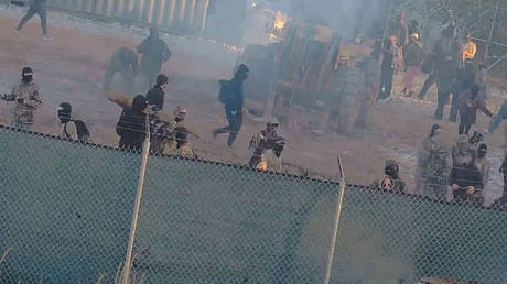 Screenshot from a video provided by the Atlanta Police Department shows protesters throwing bricks at a construction site in Atlanta, Georgia on March 5, 2023.