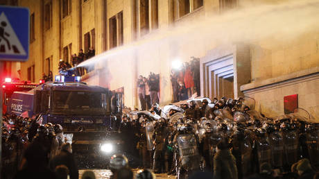 Riot police use water cannon and tear gas to disperse protesters during a protest against bill on foreign influence transparency in Tbilisi, Georgia on March 07, 2023.