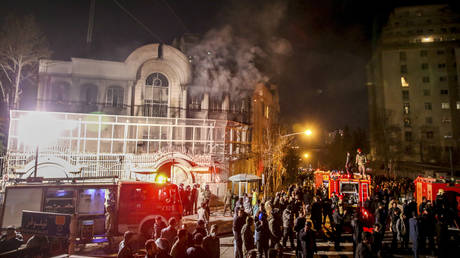 FILE PHOTO: Smoke rises as Iranian protesters set fire to the Saudi embassy in Tehran, Iran, January 3, 2016