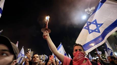 Israelis protest the government plan to introduce judicial changes in Tel Aviv, Israel on March 9, 2023.