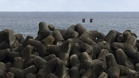 Offshore pillars mark the location of an undersea waste disposal tunnel near the Fukushima Daiichi nuclear power plant in Okuma, Japan, February 22, 2023