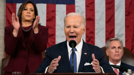 Vice President Kamala Harris (left) claps in the background as President Joe Biden gives his State of the Union address to Congress last month in Washington.
