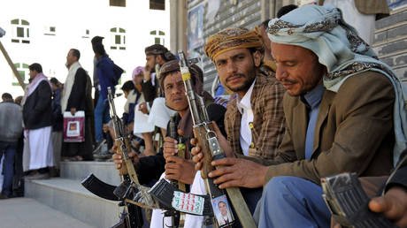 FILE PHOTO: Members of the Houthi Ansarullah movement stand outside the governor's residence in Sana'a, Yemen.