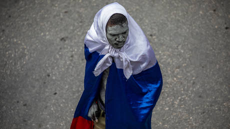 FILE PHOTO: Haitians take to the streets to protest over the increasing insecurity in the Haitian capital Port-au-Prince, on March 29, 2022.