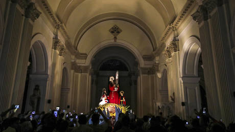 FILE PHOTO. Catholic faithful carry the image of the "Jesus of the Great Power" during a procession on Holy Week, at La Merced church in Granada, Nicaragua.