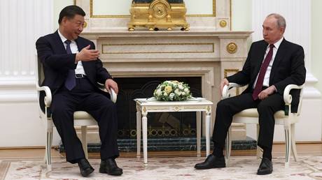 Chinese President Xi Jinping and Russian President Vladimir Putin attend a meeting at the Kremlin in Moscow, Russia.