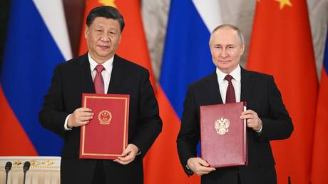 Chinese President Xi Jinping and Russian President Vladimir Putin after signing a joint statement on deepening comprehensive partnership and strategic cooperation at the Kremlin, in Moscow, Russia.