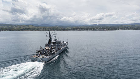 In this handout provided by the Australian Department of Defence, Armadale Class Patrol Boat, HMAS Armidale, sails into the Port of Honiara on December 1, 2021