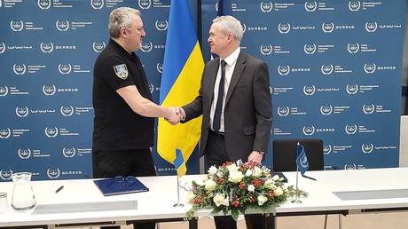 Ukraine's Prosecutor General Andrey Kostin and Secretary of the International Criminal Court Peter Lewis in The Hague, March 23, 2023