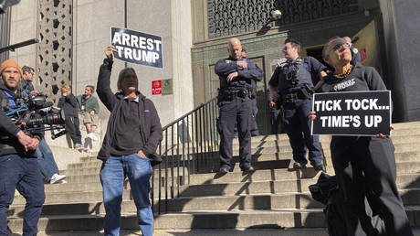 FILE PHOTO: Members of the news media, protesters and New York State Court Officers are at the front steps of 80 Centre Street on March 20, 2023, in New York City