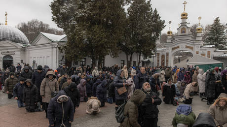 People attend a service of the Ukrainian Orthodox Church at a compound of Kiev Pechersk Lavra on March 29, 2023.