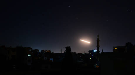 FILE PHOTO: Syria's air defenses intercept an Israeli missile in the sky over Damascus, Syria, February 24, 2020.
