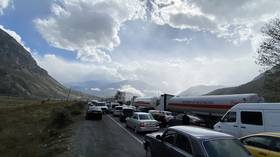 Cars line up to enter Russia from Georgia