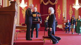 Queen guitarist receives knighthood