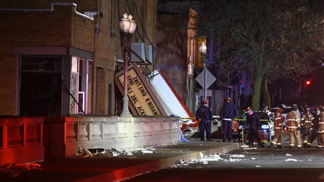 Authorities work the scene at the Apollo Theatre after a severe spring storm caused damage and injuries during a concert in Belvidere, Illinois, March 31, 2023