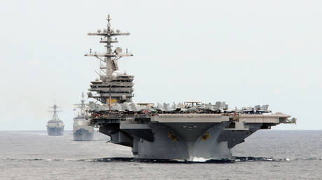 FILE PHOTO: An aircraft carrier strike group led by the USS George HW Bush is seen during an exercise in the Philippine Sea.