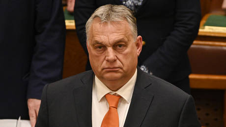 Viktor Orban stands after a vote on Finland's bid to join NATO at the parliament in Budapest, Hungary, March 27, 2023