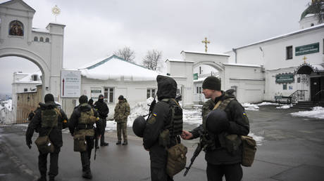 Ukraine's Security Service (SBU) servicemen stand in front of the entrance of Kyiv Pechersk Lavra monastery in Kiev.