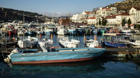 Boats moored to the pier are seen in Balaclava Bay in Sevastopol, Russia.