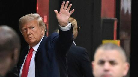 Former US President Donald Trump waves as he arrives at Trump Tower in New York on April 3, 2023.