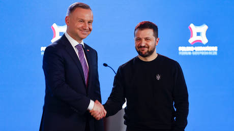 Polish President Andrzej Duda (L) and Ukrainian President Vladimir Zelensky shake hands in Warsaw, Poland, on April 5, 2023.