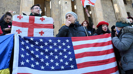 File photo: Protesters outside the parliament in Tbilisi hold US and Georgian flags, March 8, 2023