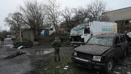 Russian investigators inspect the site where a Ukrainian artillery strike killed nine civilians, Donetsk, April 6, 2023.