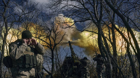 FILE PHOTO: Ukrainian soldiers fire a self-propelled howitzer at the front line near the city of Artyomovsk, March 5, 2023.