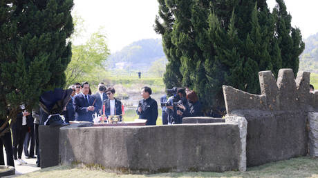 Ma Ying-jeou, former chairman of the Chinese Kuomintang party, and his sisters pay respects to their ancestors at the tomb of his grandfather on April 1, 2023 in Xiangtan County, Xiangtan City, Hunan Province of China
