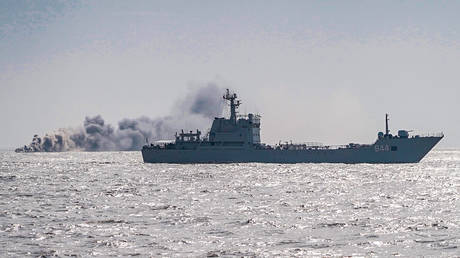 FILE PHOTO: A Chinese vessel releases smoke screen during a maritime training exercise.