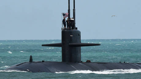 A nuclear-powered U.S. Navy submarine cruises into the Navy Port at Port Canaveral on 2023/03/08