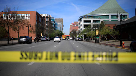 Crime scene tape cordons off a street as law enforcement officers respond to an active shooter near the Old National Bank building on April 10, 2023 in Louisville, Kentucky.