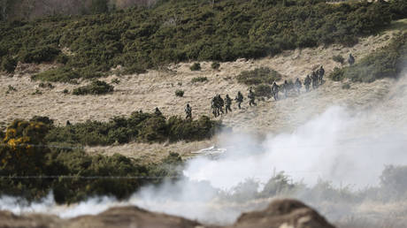 FILE PHOTO: Ukrainian soldiers take part in a military exercise at a training camp in Northern England, February 16, 2023