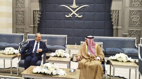 Saudi Deputy Foreign Minister Waleed Al-Khuraiji meets with Syrian Foreign Minister Faisal Mekdad, upon his arrival at King Abdulaziz International Airport in Jeddah, Saudi Arabia, April 12, 2023