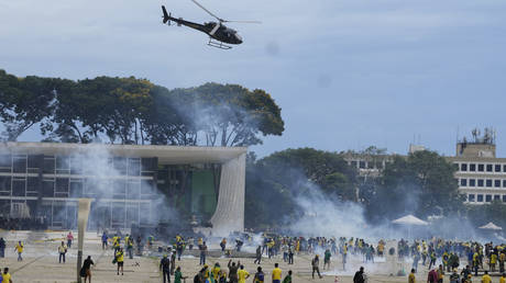 FILE PHOTO: Protesters clash with police as they storm the Planalto Palace, the official workplace of the president, in Brasilia, Brazil, January 8, 2023