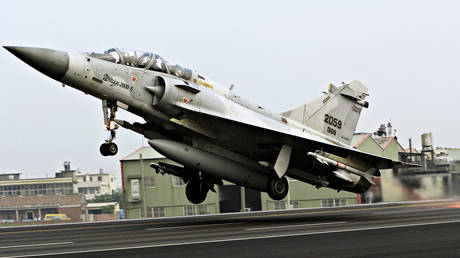 A Mirage 2000 jet fighter of the Taiwan Air Force takes off from a stretch of Sun Yat Sen Freeway near Hua Tan