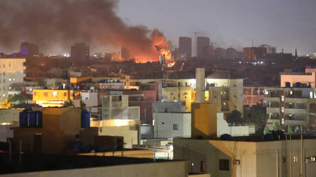 Smoke rises as clashes continue in the Sudanese capital on April 16, 2023 between the Sudanese Armed Forces and the paramilitary Rapid Support Forces (RSF).