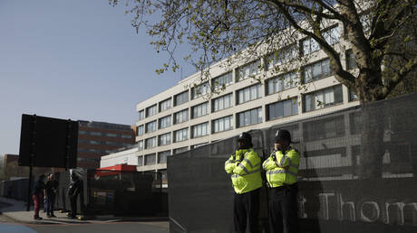 FILE PHOTO: Police officers stand guard outside St Thomas' Hospital in London, Britain, April 10, 2020