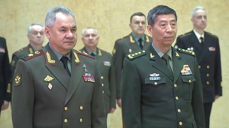 Russia’s Defense Minister Sergey Shoigu greets his Chinese counterpart Li Shangfu ahead of talks with Moscow.
