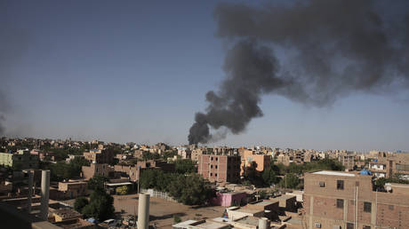 Smoke is seen rising amid clashes between government and paramilitary forces in Khartoum, Sudan, April 19, 2023.