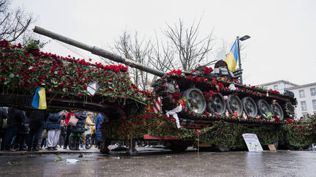 Roses on a destroyed Russian tank type T-72 next to the Russian embassy to commemorate the first anniversary of Russia's war in Ukraine on February 25, 2023 in Berlin, Germany.