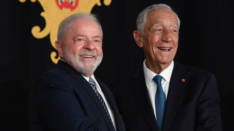 Brazil's President Luiz Inacio Lula da Silva (L) meets Portugal's president Marcelo Rebelo de Sousa (R) prior to talks at the Belem Palace in Lisbon on April 22, 2023.