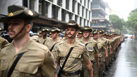 Members of the Australian Defence Forces (ADF) march during an Anzac Day parade on April 25, 2022 in Brisbane, Australia